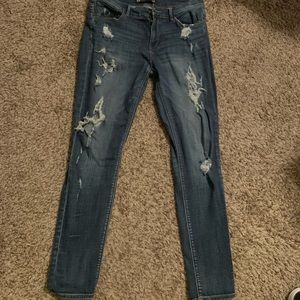 Dark wash extremely destroyed denim